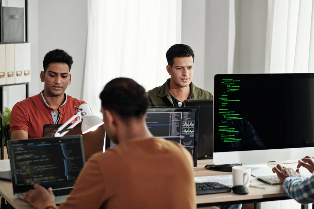 Step-by-Step Guide to Creating a Winning Digital Marketing Strategy in 2025 4 devops engineers working office 1024x683 1